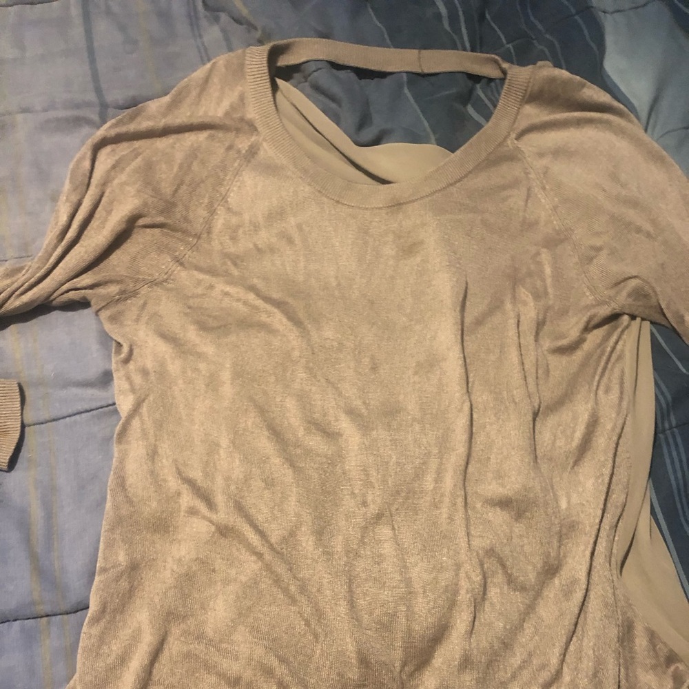 Shear back beige sweater.